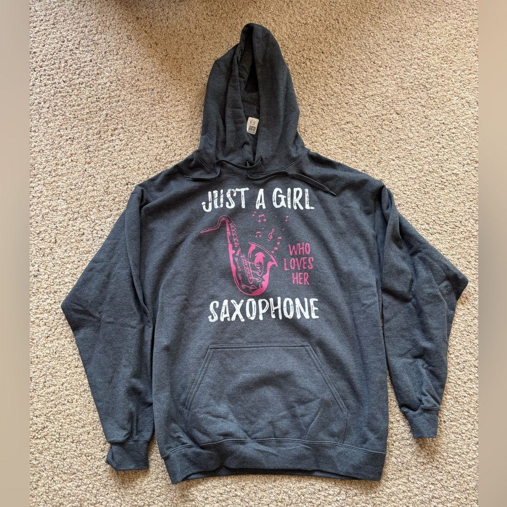 Gray Hooded sweatshirt 
Says “Just a Girl Who Loves Her Saxophone”
